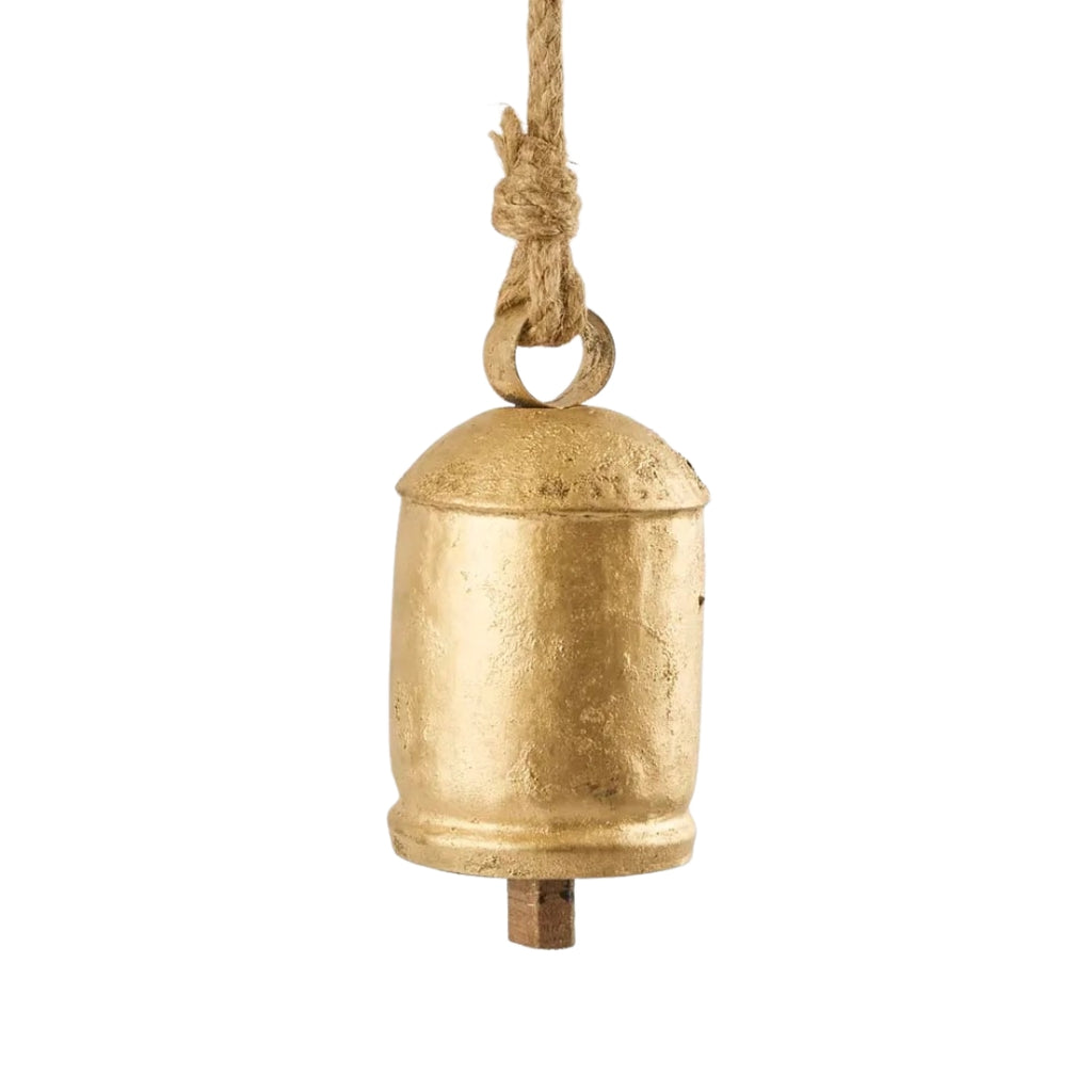 Gold aged look bell with a rope on a white background
