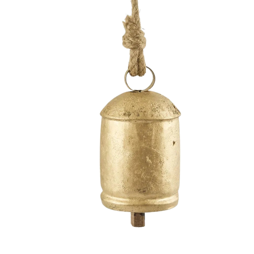 Gold aged look bell with a rope on a white background