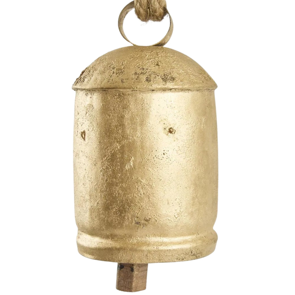 Gold aged look bell with a rope on a white background