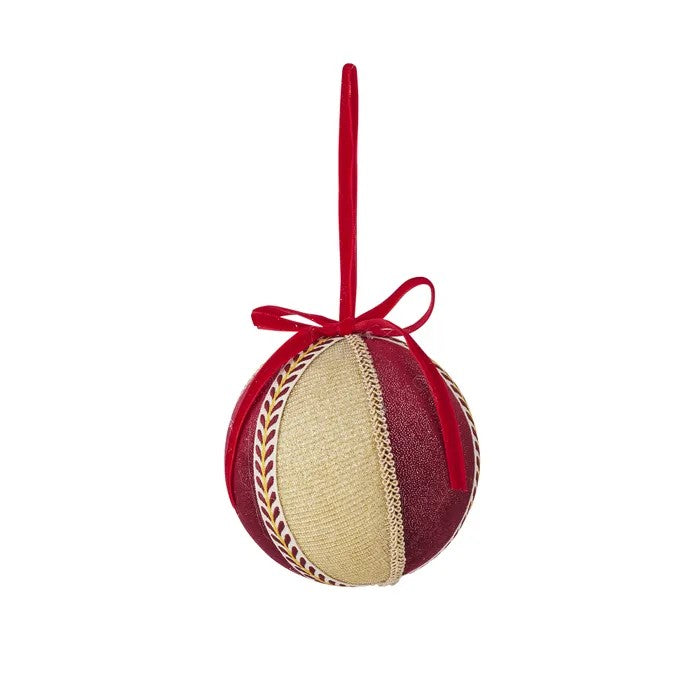 Velvet round bauble in red and gold fabric with gold and patterned braiding and red velvet bow on white background