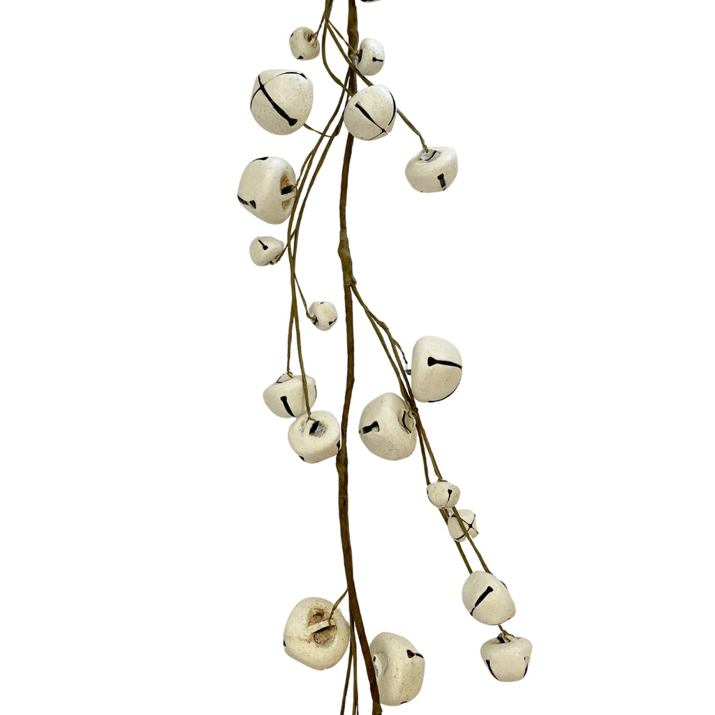 A garland of white metal bells with brown tape-covered wires  - closer view