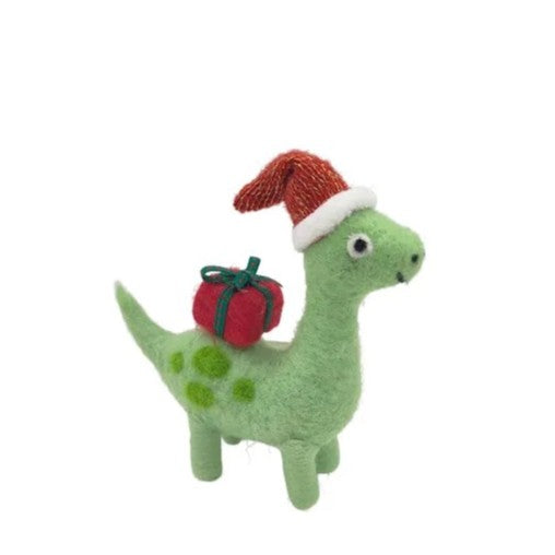 Green felt hanging dinosaur with a red gift on it's back and red santa hat  on a white background