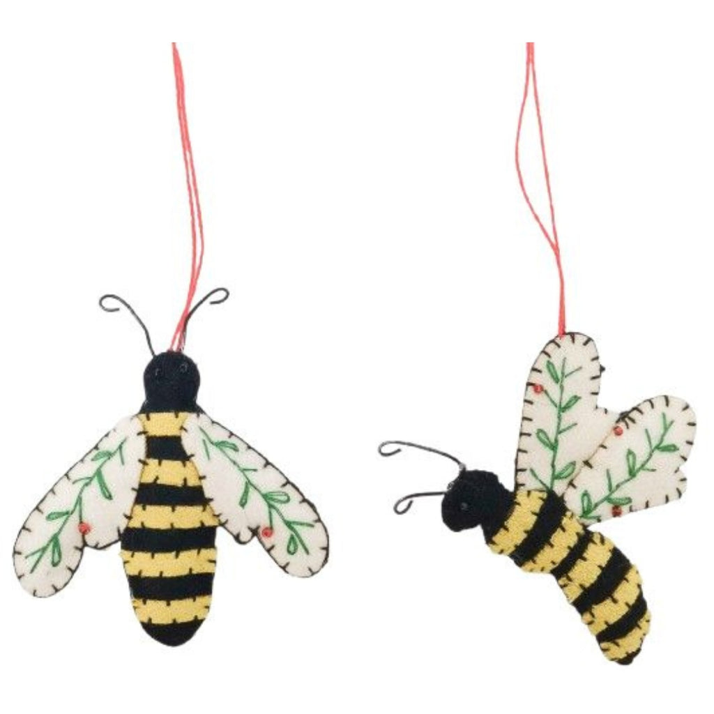 Two bee-shaped ornaments with black and yellow stripes on a white background