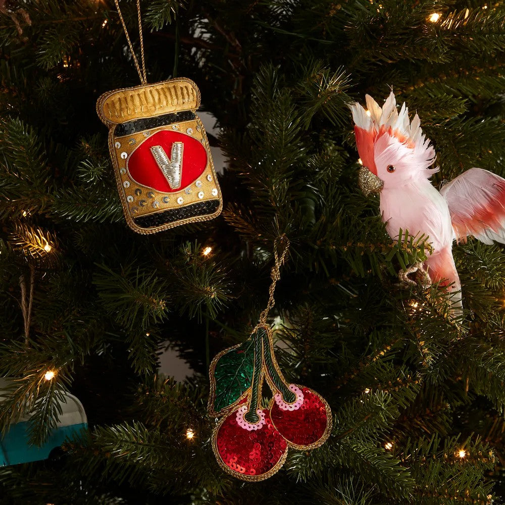 Decorative Christmas ornaments including a Major Mitchell on a tree with lights