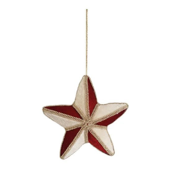 Velvet star decoration in red and gold hanging on white background