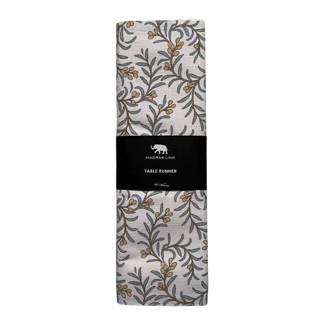 Packaged table runner with Juniper berry and leaf pattern in blue and apricot on a white background - size 40x200cm