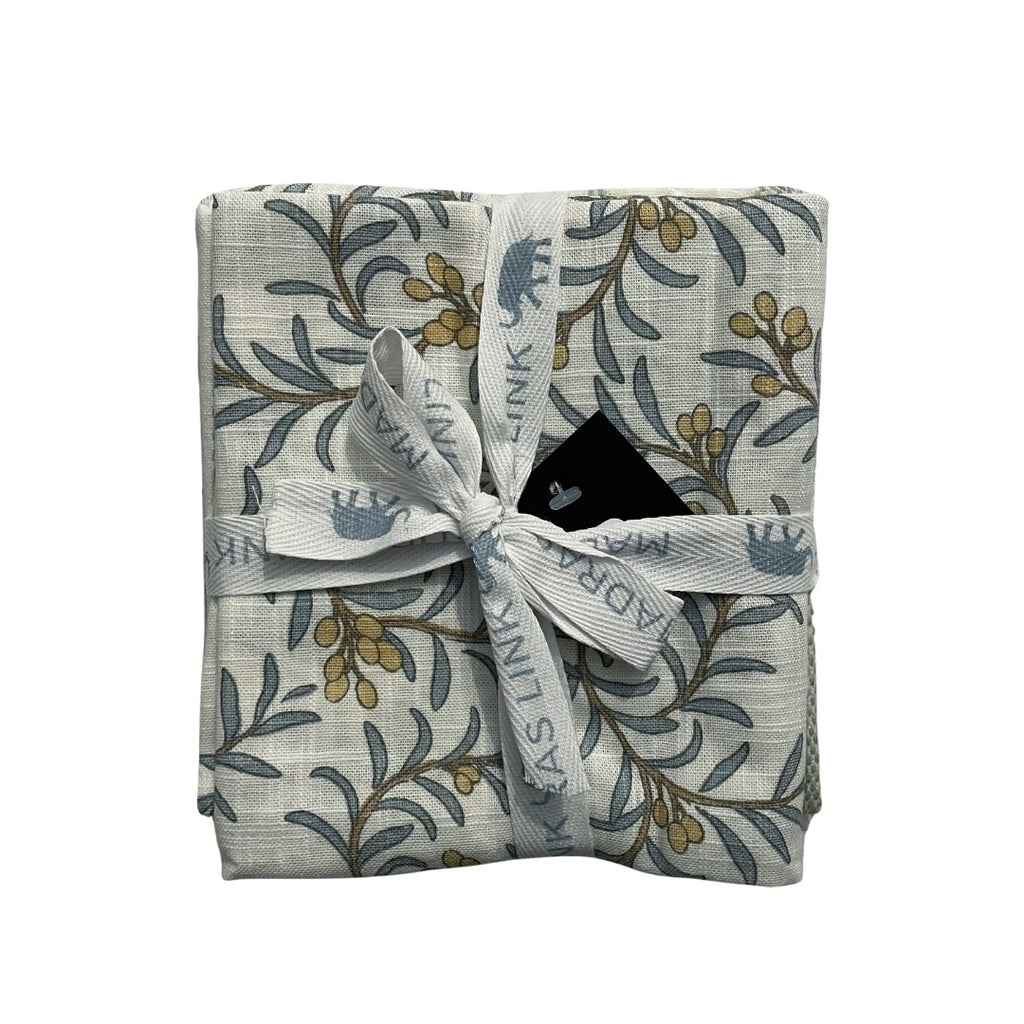 Bundle of 3 juniper berry and leaf tea towel set with ribbon on a white background