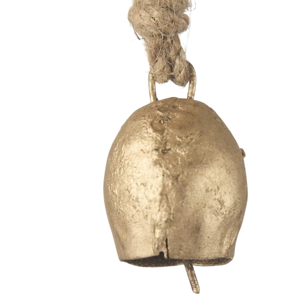 Mini Bronze cow bell with a string on a white background