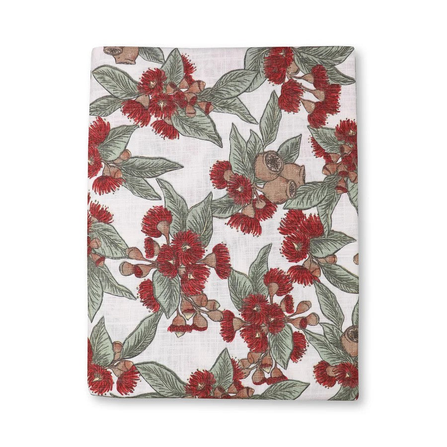 Australian Flowering gum tablecloth in red with floral design featuring red flowers, gumnuts and green leaves on a white background