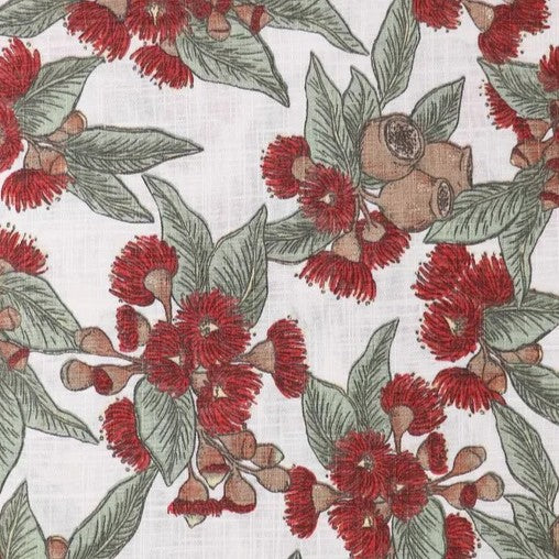 Fabric Pattern of red flowering gum and green gum leaves and gumnuts on a white background