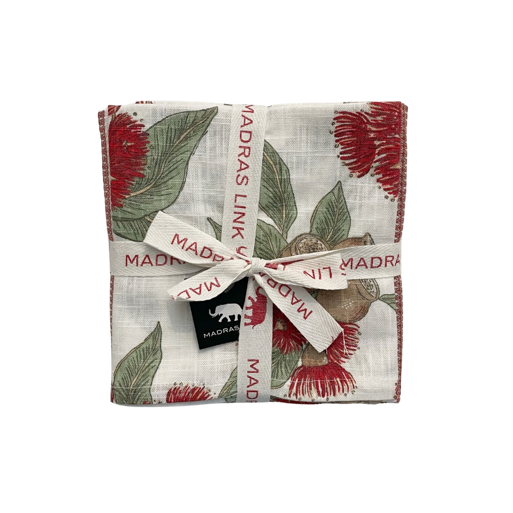 Set of 3 flowering gum tea towels in varying patterns bundled - top tea towel showing flowering gum in red green and brown on off white base