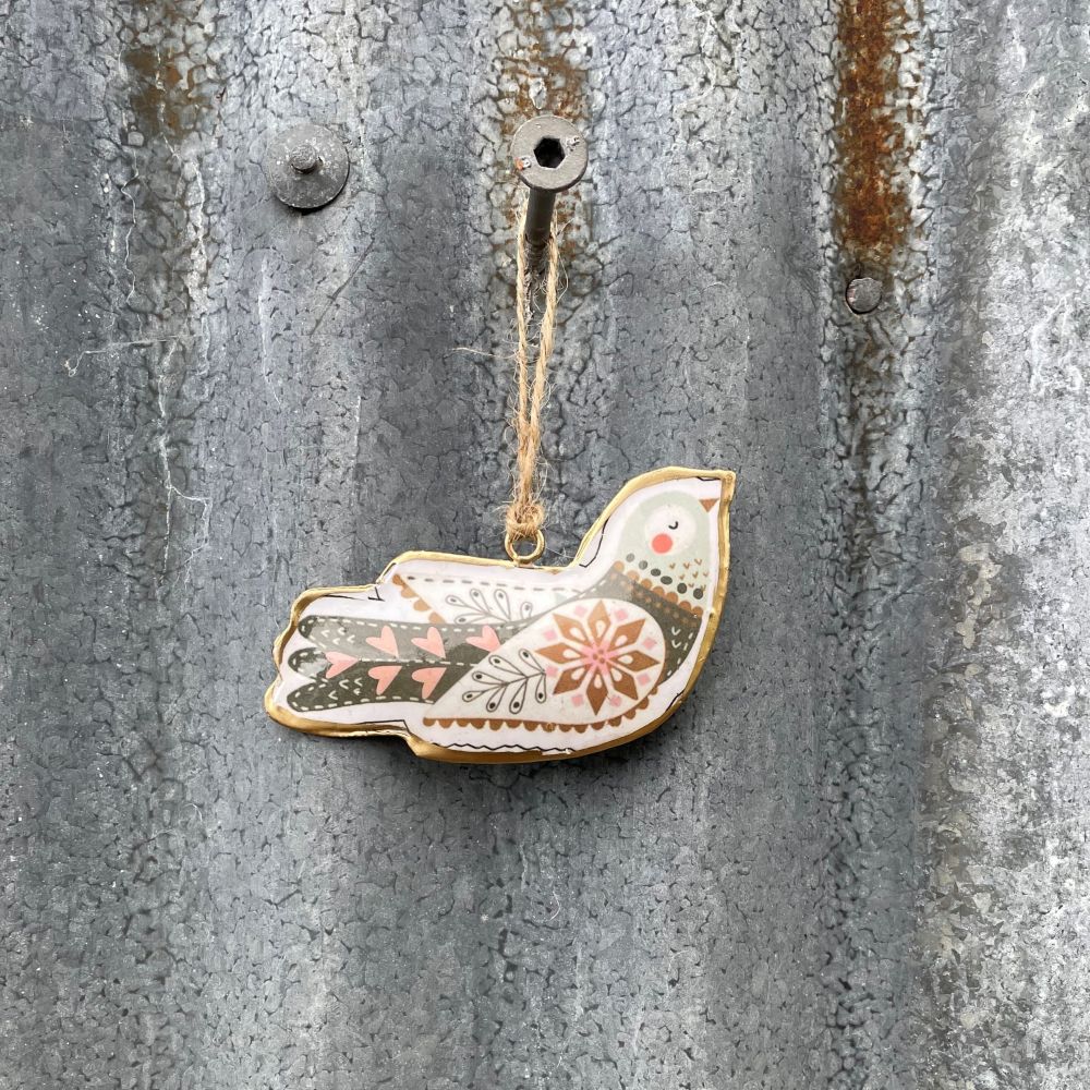 Decorative Metal Nordic bird ornament hanging on a textured metal surface - second design from set of 2