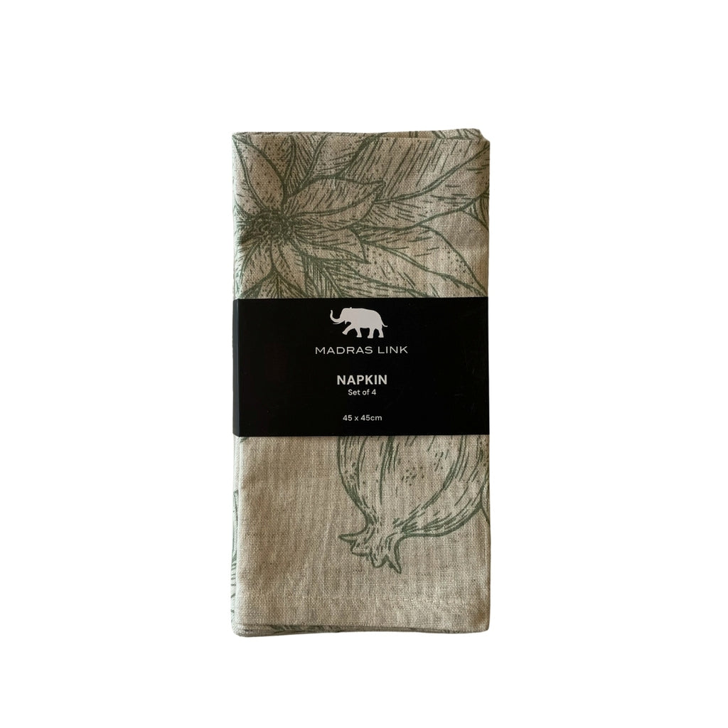 Set of four napkins with pomegranate and pine leaf pattern in packaging, featuring Madras Link brand.