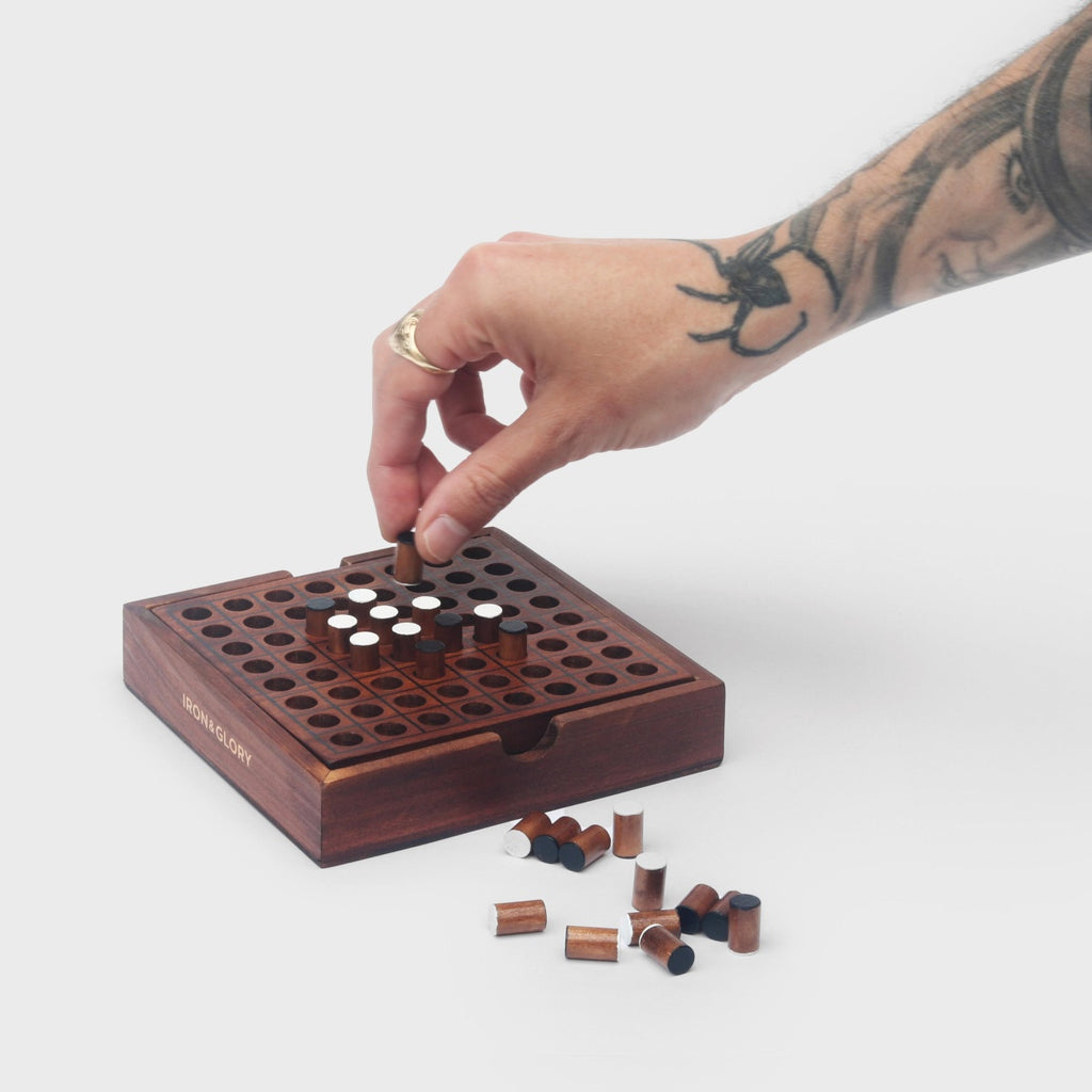 Wooden Reversi game board with pieces on a white background - available from Twig and Feather