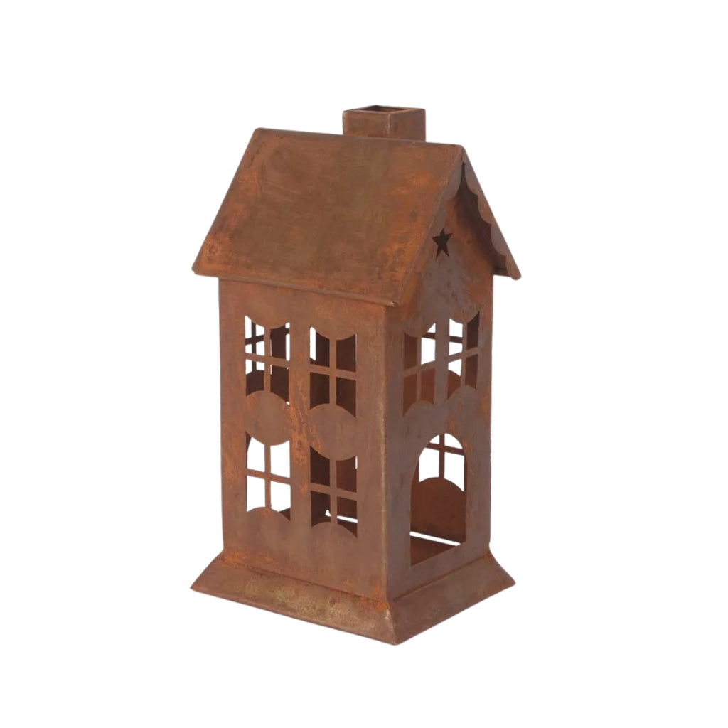 Rusty metal lantern or candle holder in house design on a white background