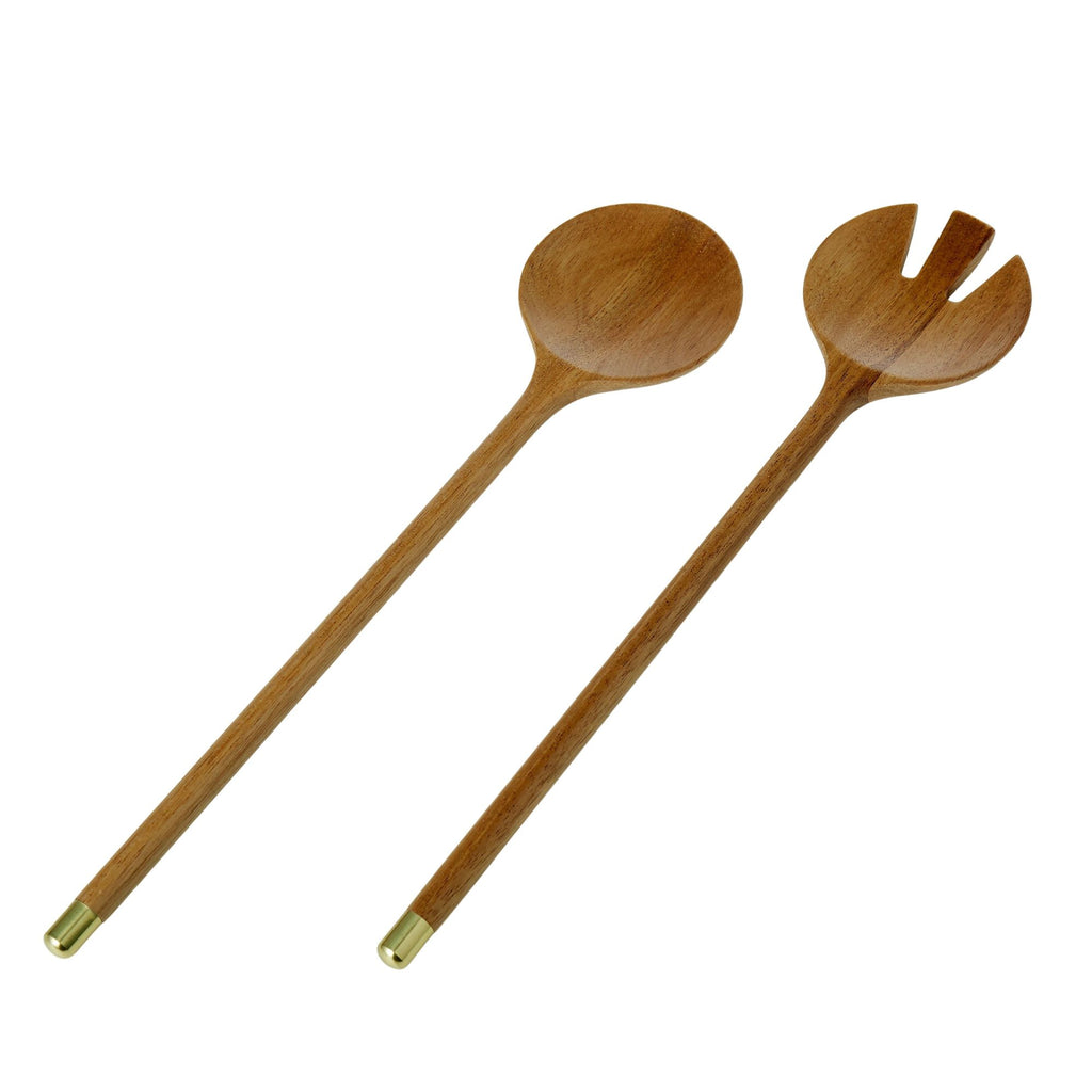 Acacia wood salad servers with brass tips on a white background