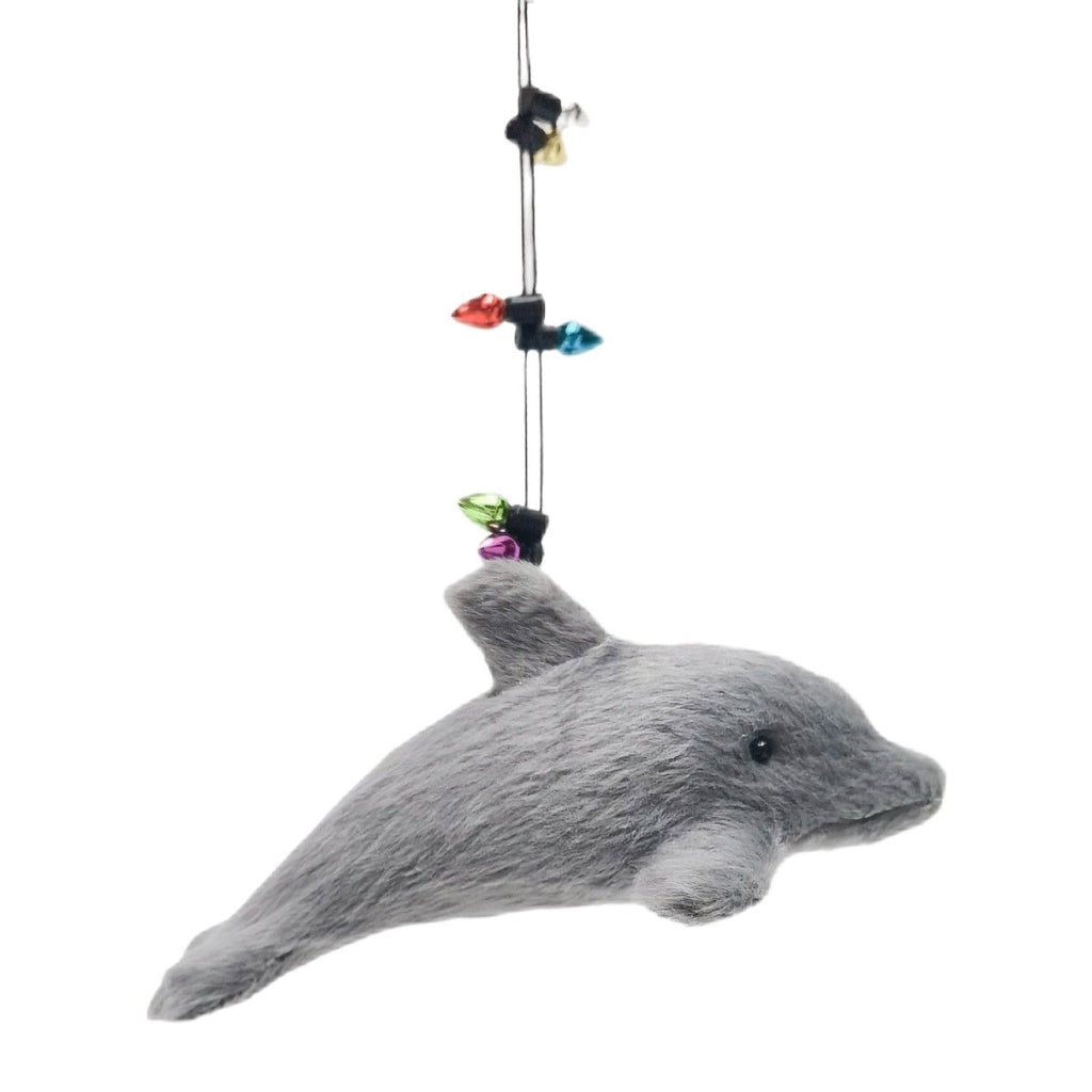 Grey dolphin Christmas decoration with a string of colorful lights on a white background