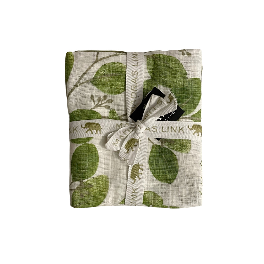 Twig and Feather - Folded tea towels with green leaf pattern and a ribbon on a white background