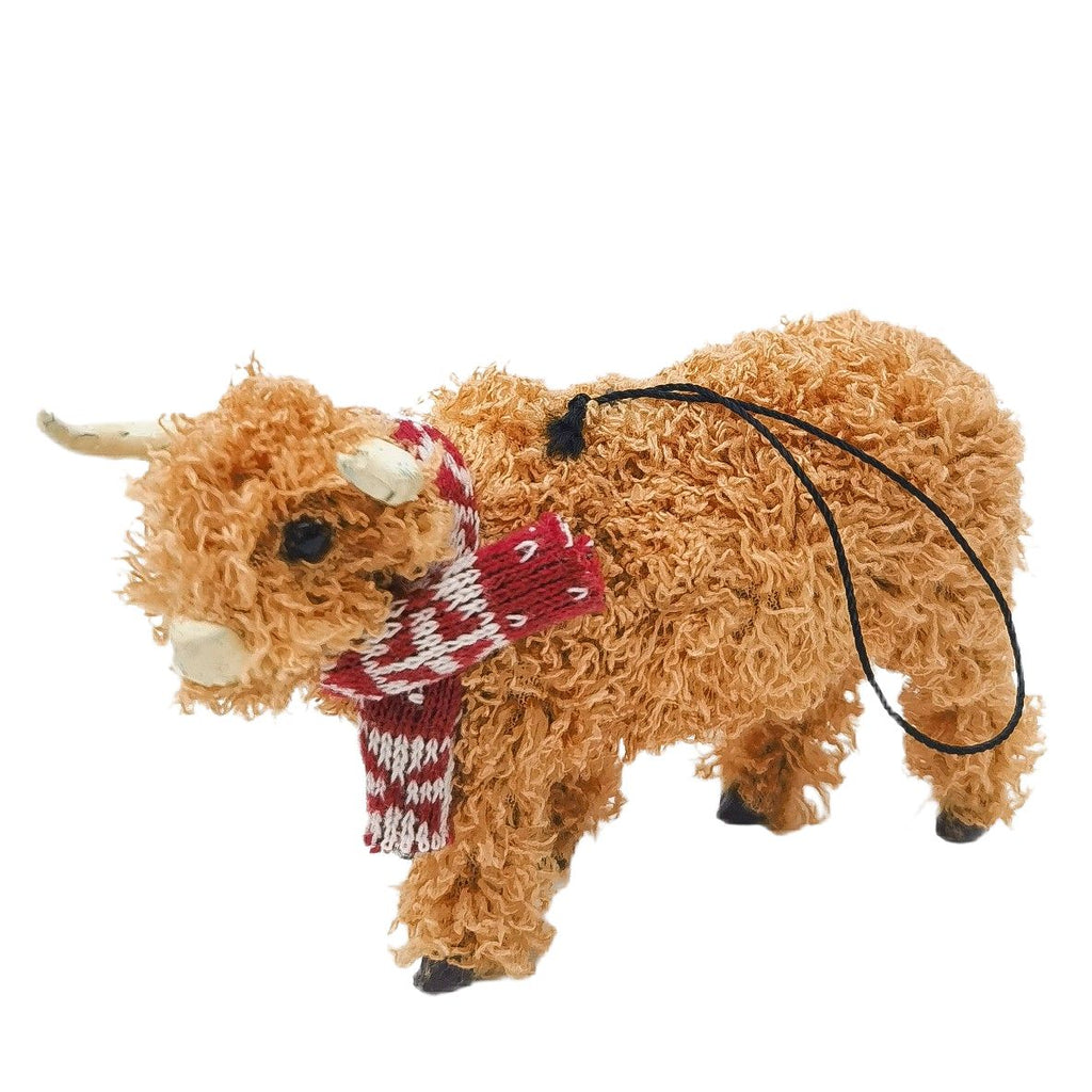 Christmas highland cow hanging decoration with a red patterned scarf on a white background