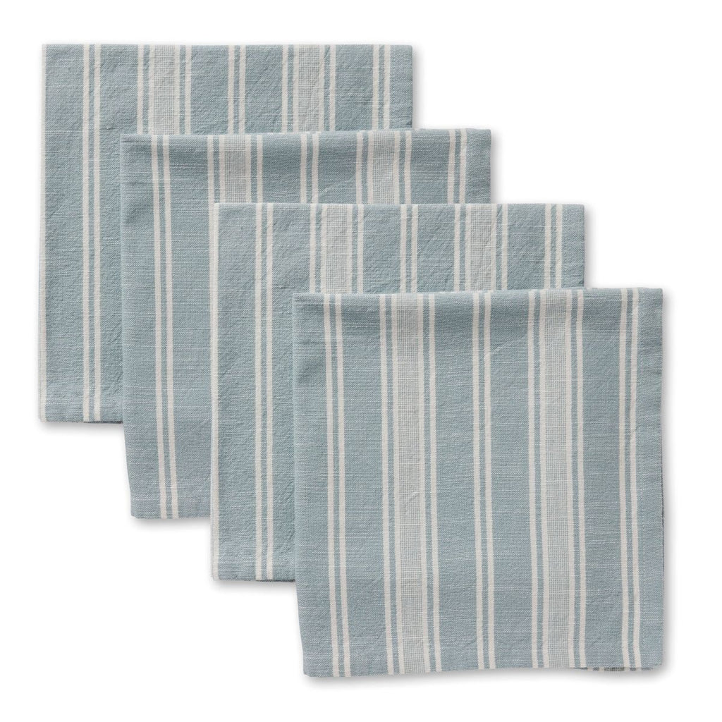 Set of four blue and white striped placemats on a white background