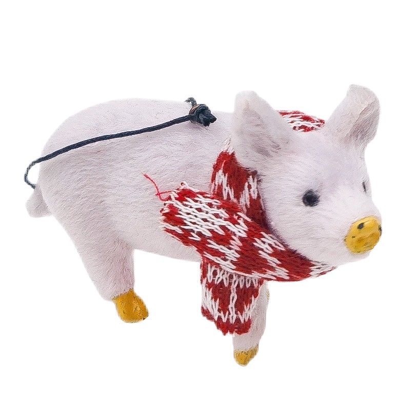 Pink pig Christmas ornament wearing a red and white patterned scarf on a white background