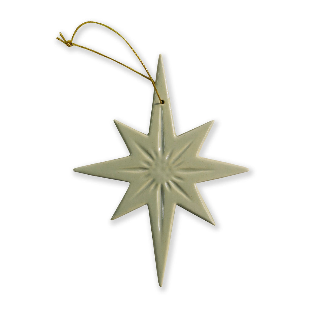 Star-shaped ceramic speckle sage green ornament on a white background