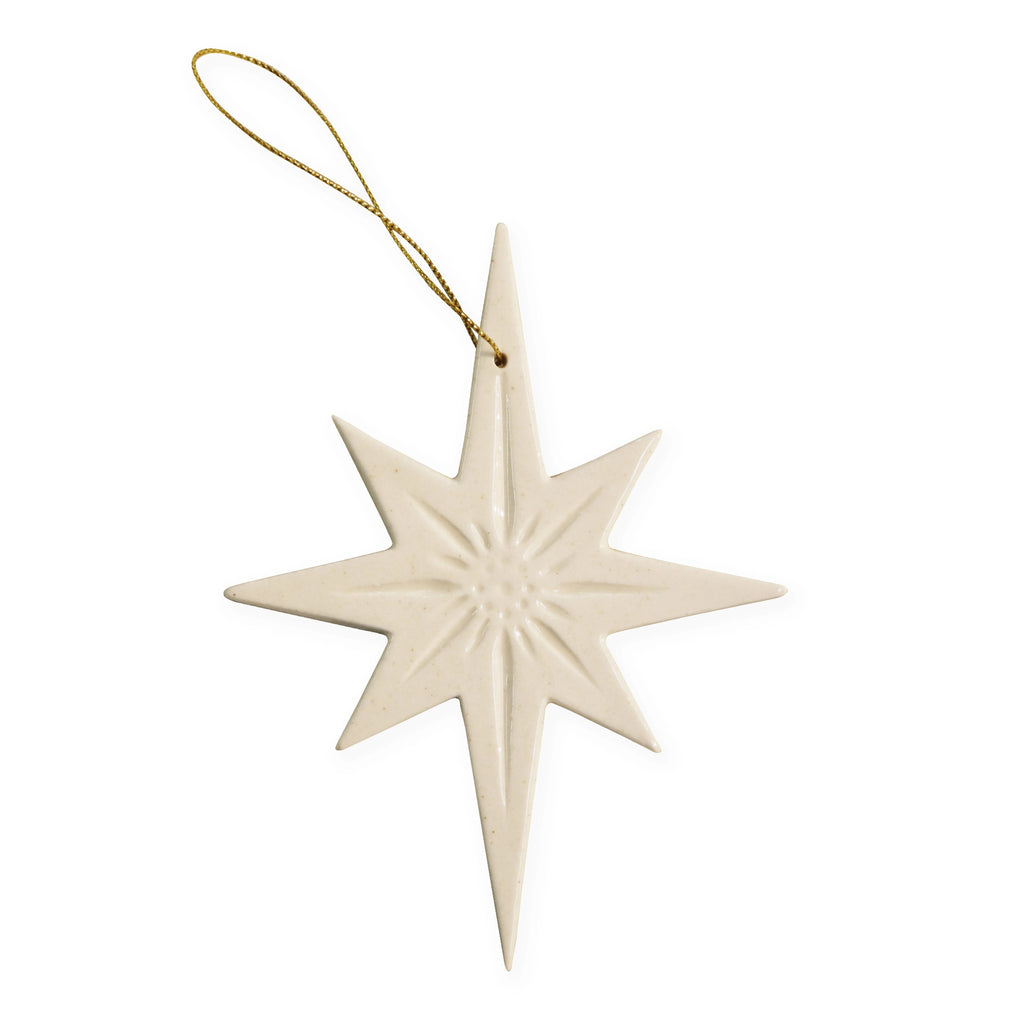 Ceramic Star-shaped ornament in white with a textured surface on a white background