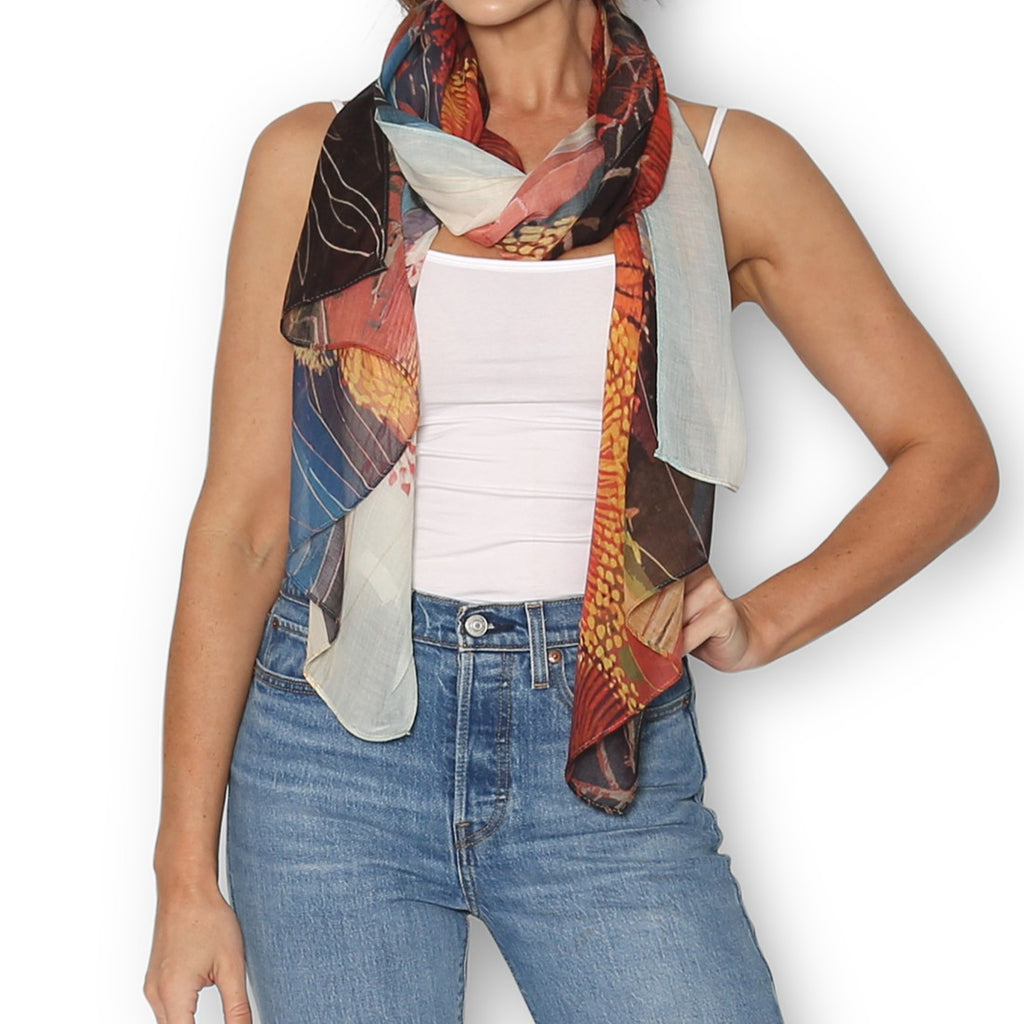 Woman wearing The Artist Label Blue Mountains Golden Hour scarf in deep oranges and browns