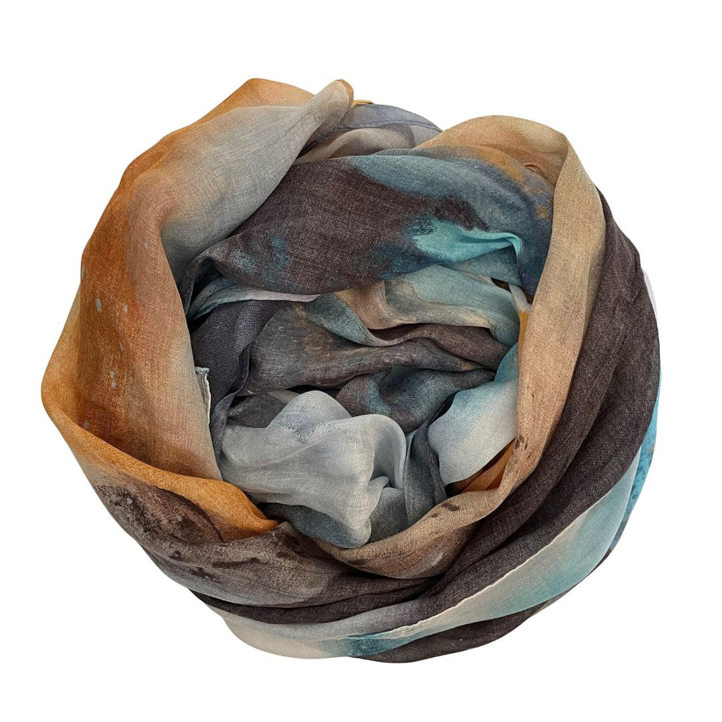 The Artist Label Transcend Multicolored scarf with brown, blue, and gray tones on a white background