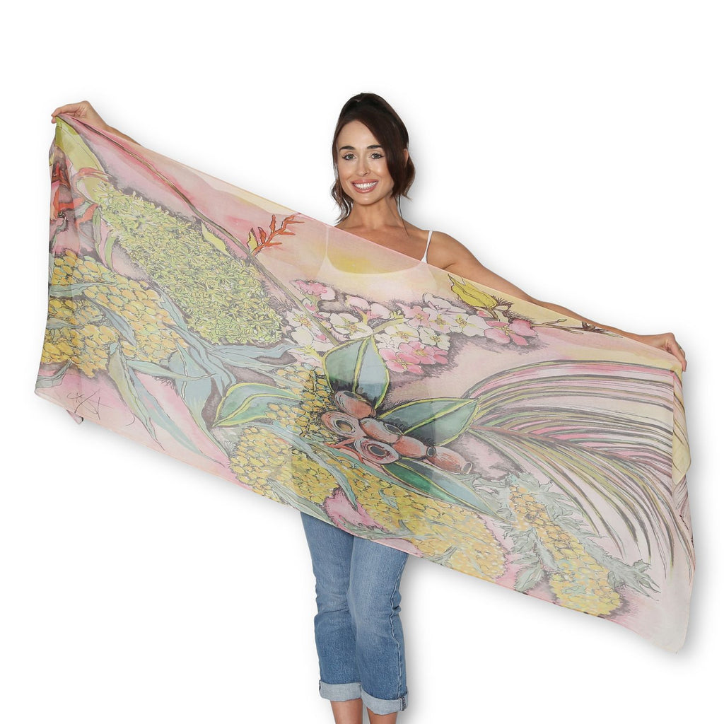 Person wearing The Artist Label Wattle Blossom scarf in golds, limes, pinks and browns
