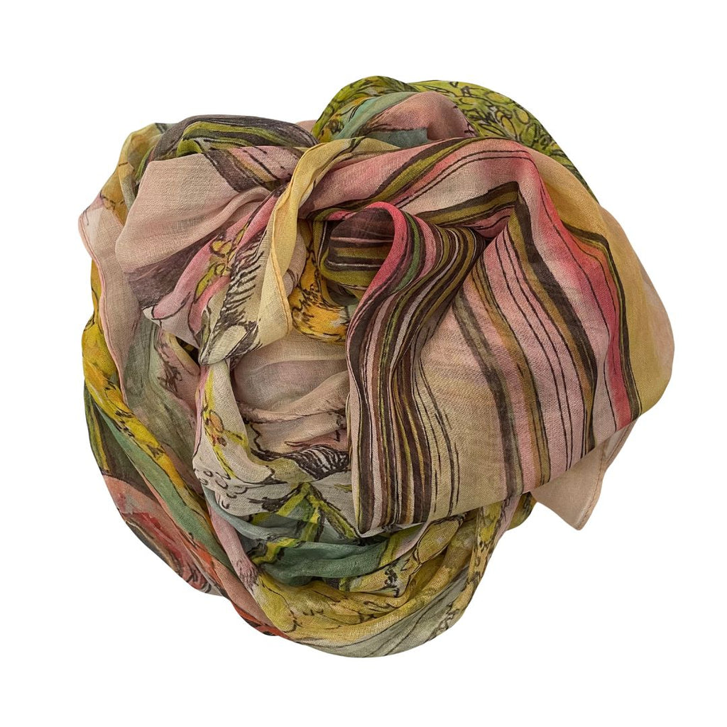 The Artist Label Wattle Blossom Colorful patterned scarf rolled up on a white background
