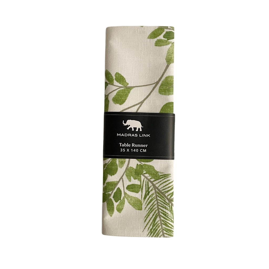 Twig and Feather - Folded table runner with gum drop green leaf pattern on a white background, featuring Madras Link branding.
