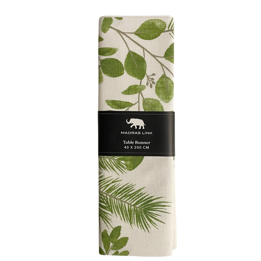 Twig and Feather - Folded table runner with gumdrop green leaf pattern on a white background, featuring the Madras Link brand.