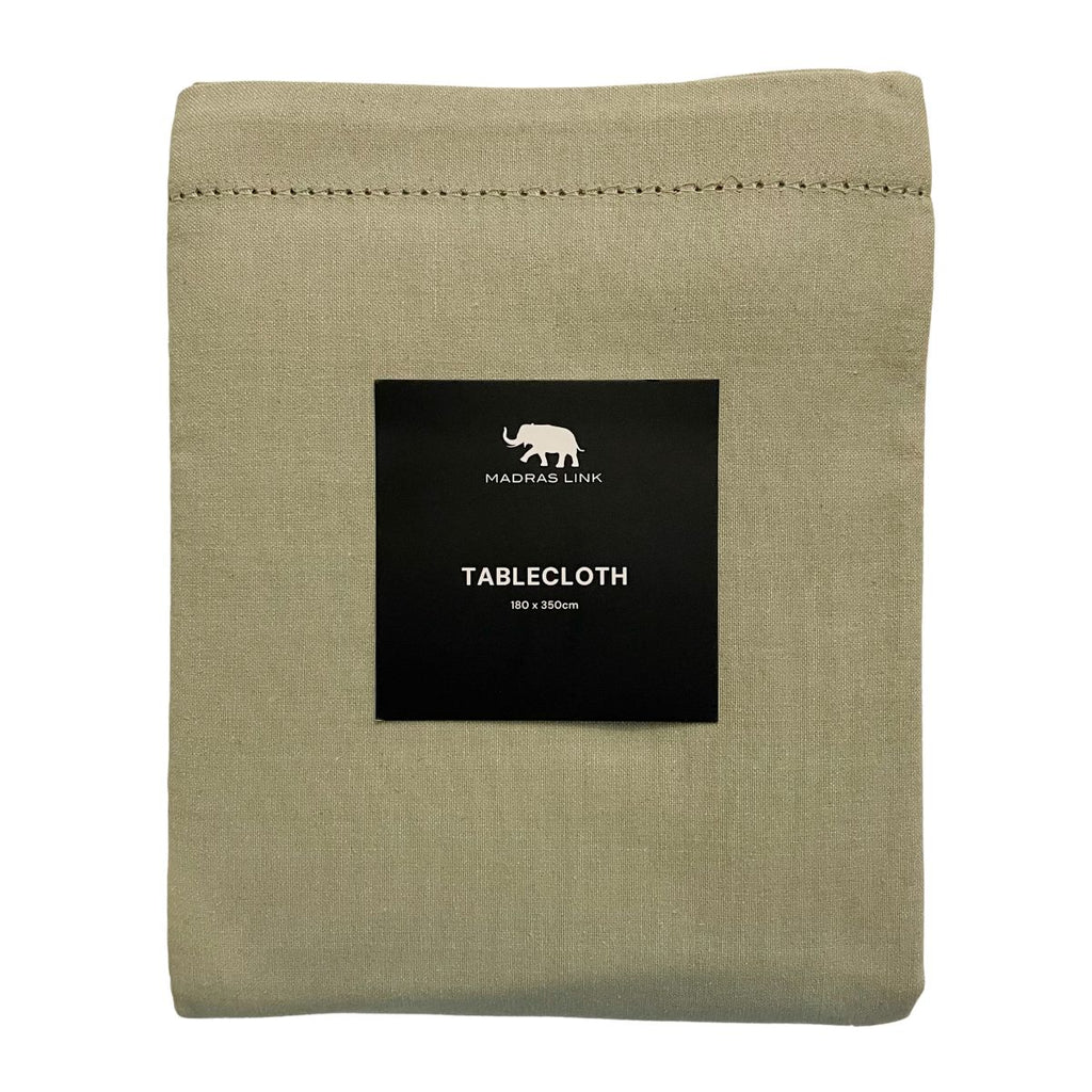 Folded mineral green tablecloth by Madras Link in size 180x350cm