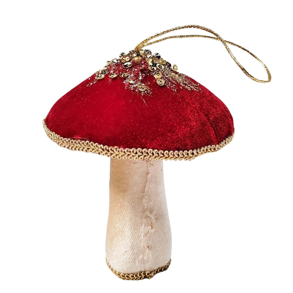 Decorative velvet mushroom ornament with red cap and beige stem on a white background