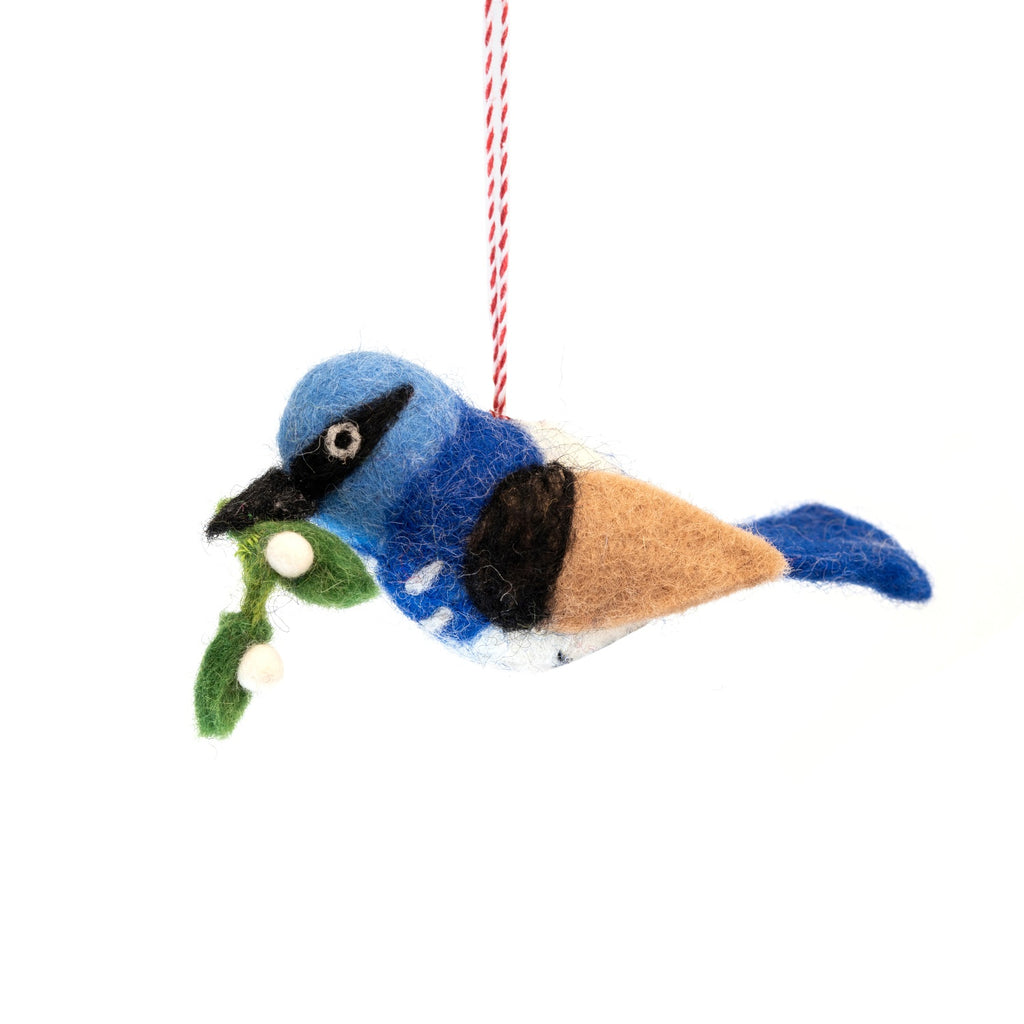 Felted blue wren ornament with mistletoe on a white background