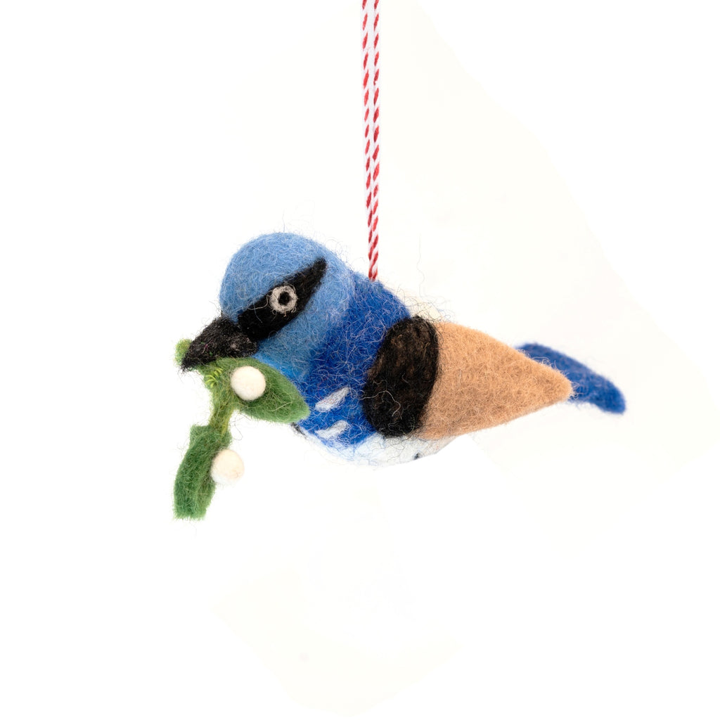 Felted blue wren ornament with mistletoe on a white background