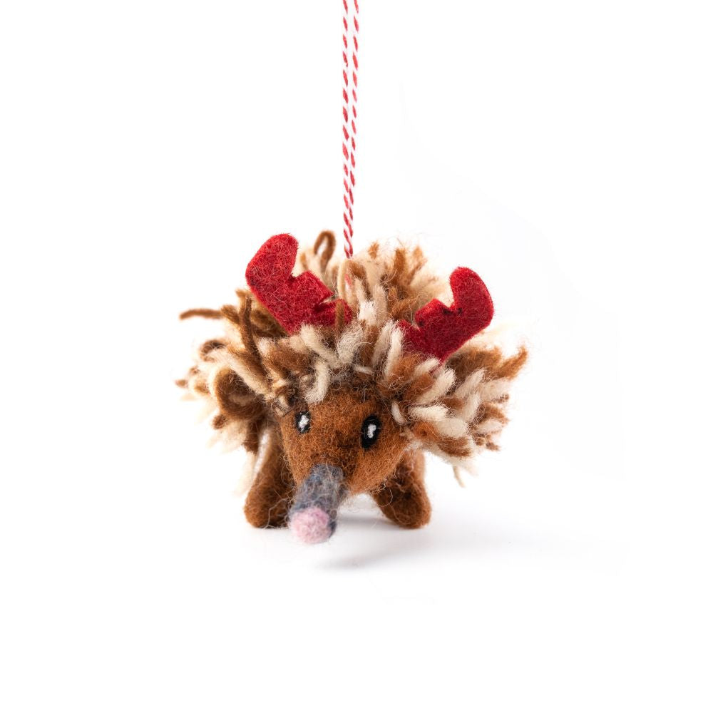 Felted Echidna hanging decoration with red antlers on a white background