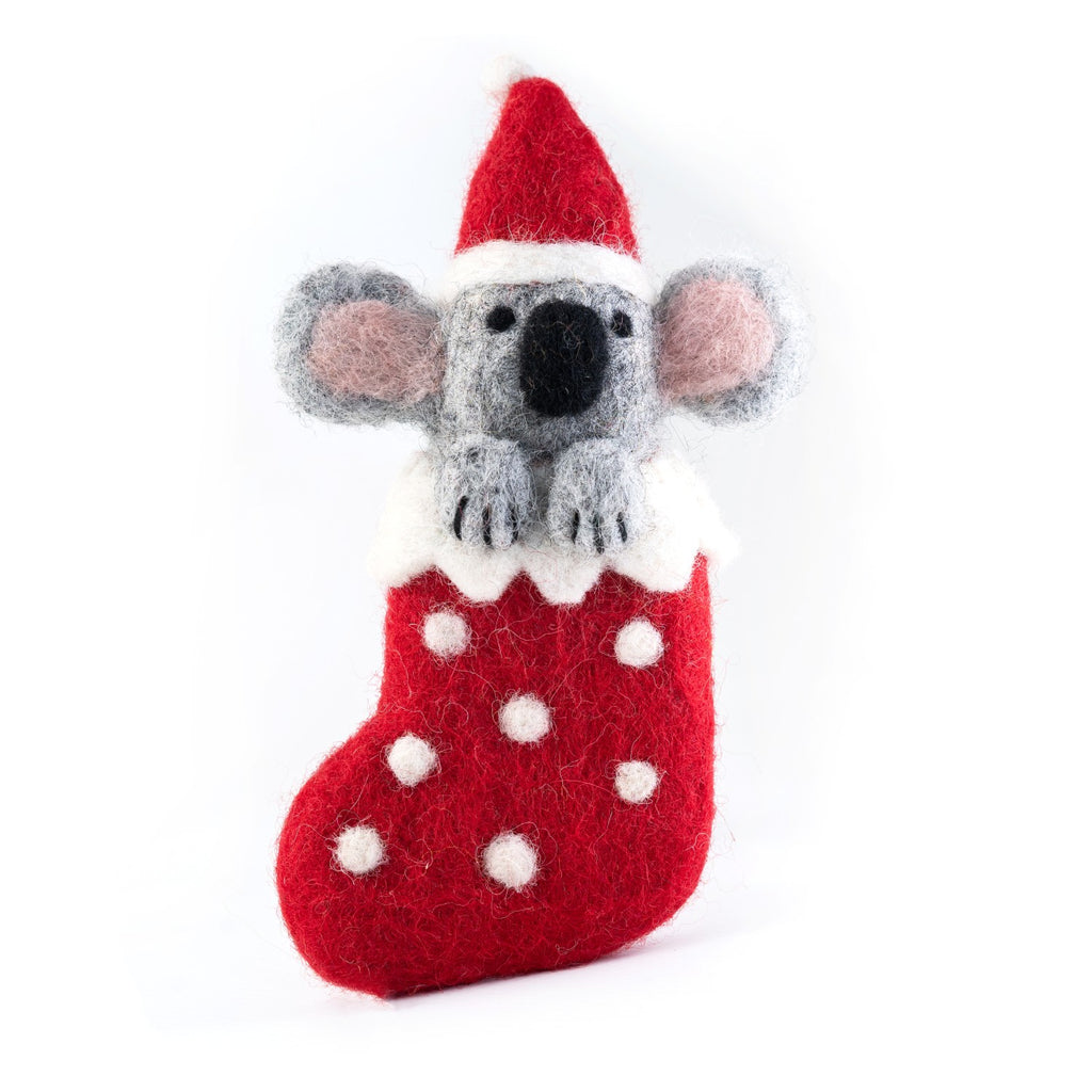 Felted koala ornament in a red stocking with white polka dots on a white background