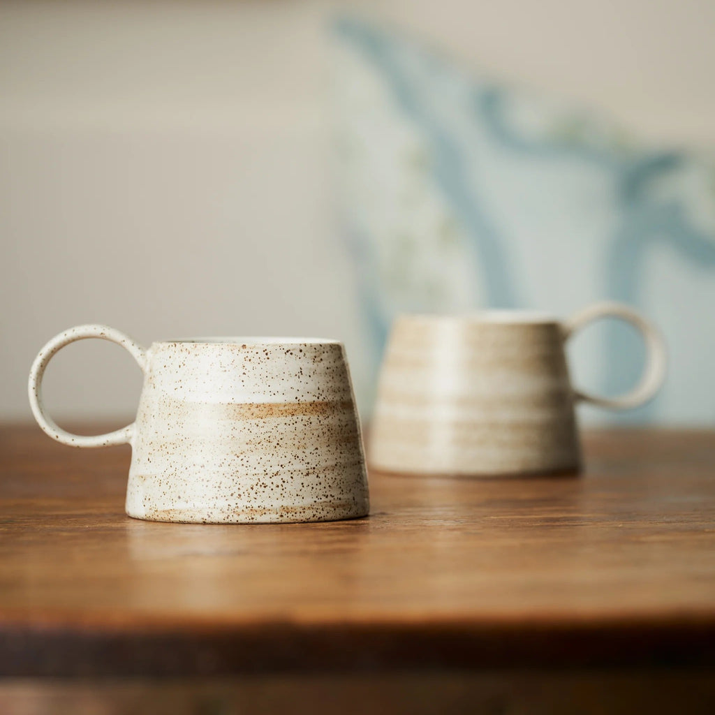 Twig and Feather - Ceylon wide handle mug with flat base and a brown speckle finish on white stoneware - by Robert Gordon